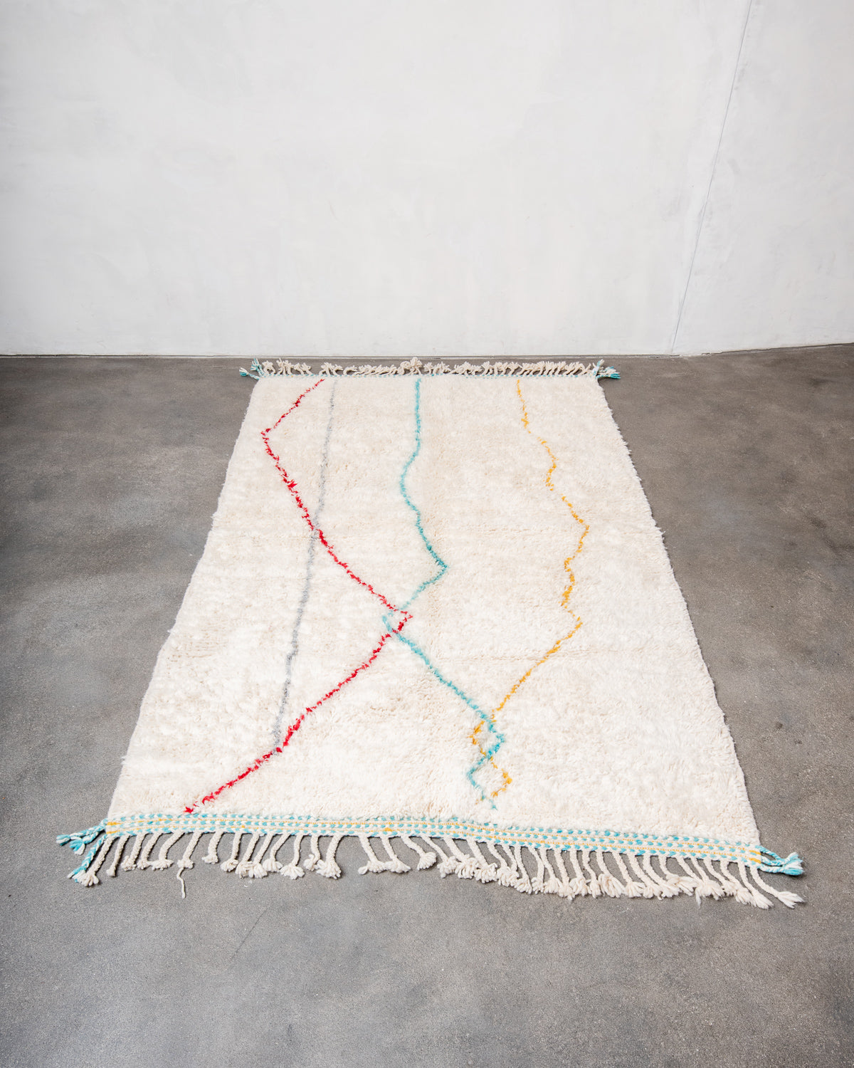 Modern, designer, handcrafted Berber rug from Morocco. Beniourain carpet with minimalist design, natural wool pile and a fluffy texture.